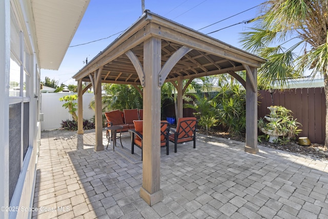 208 Atlantic Blvd, Indian Harbour Beach, FL 32937 - fenced backyard with a patio, an outdoor living space, and a gazebo