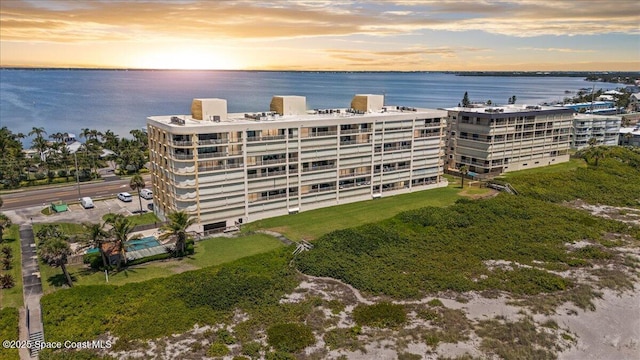 3221 S Atlantic Ave Unit 703, Cocoa Beach, FL 32931 - property at dusk with a water view