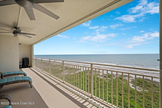 3221 S Atlantic Ave Unit 703, Cocoa Beach, FL 32931 - balcony with ceiling fan and view of water and beach