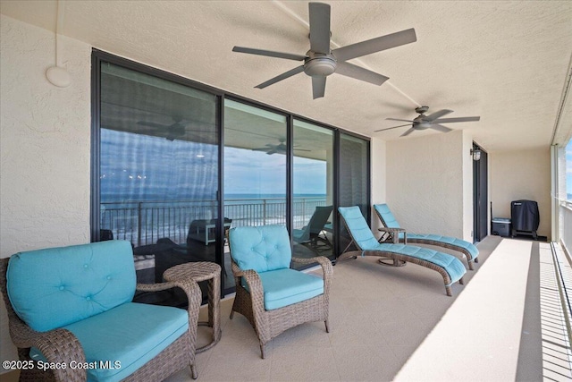 3221 S Atlantic Ave Unit 703, Cocoa Beach, FL 32931 - patio / terrace with a ceiling fan and a water view