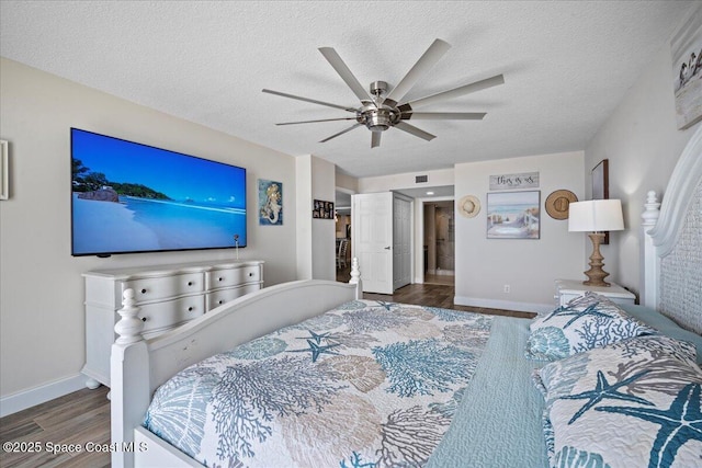3221 S Atlantic Ave Unit 703, Cocoa Beach, FL 32931 - bedroom with wood finished floors, a textured ceiling, and a ceiling fan