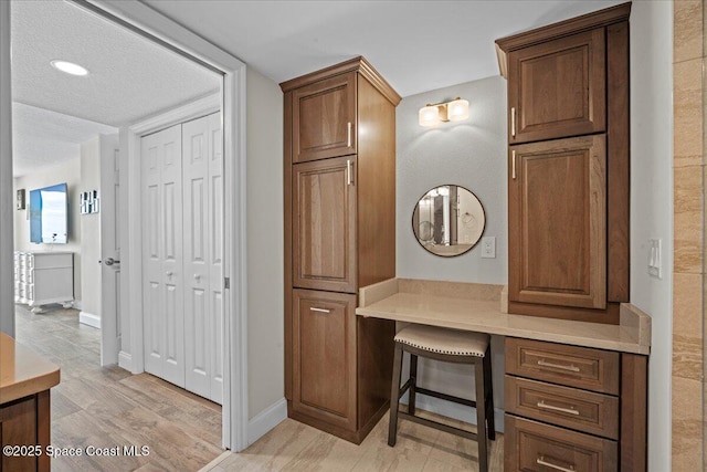 3221 S Atlantic Ave Unit 703, Cocoa Beach, FL 32931 - home office with light wood-style flooring and built in study area