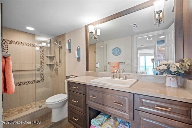 3221 S Atlantic Ave Unit 703, Cocoa Beach, FL 32931 - full bath with a shower stall, vanity, and wood finished floors