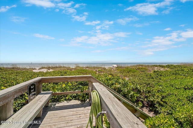 3221 S Atlantic Ave Unit 703, Cocoa Beach, FL 32931 - wooden terrace featuring view of water and beach