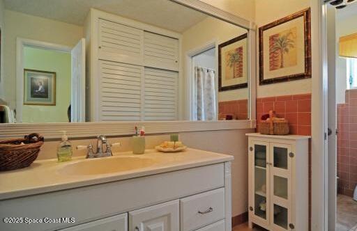 1310 SW 9th Ter, Boca Raton, FL 33428 - full bathroom featuring vanity and tile walls