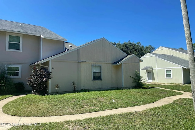 96 Tomoka Meadows Blvd, Ormond Beach, FL 32174 - view of home's exterior featuring a lawn