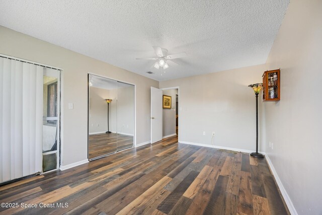1515 Huntington Ln Unit 227, Rockledge, FL 32955 - spare room featuring ceiling fan, wood finished floors, and a textured ceiling