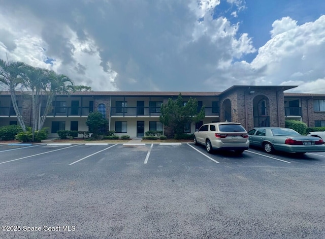 1515 Huntington Ln Unit 227, Rockledge, FL 32955 - view of building exterior with uncovered parking