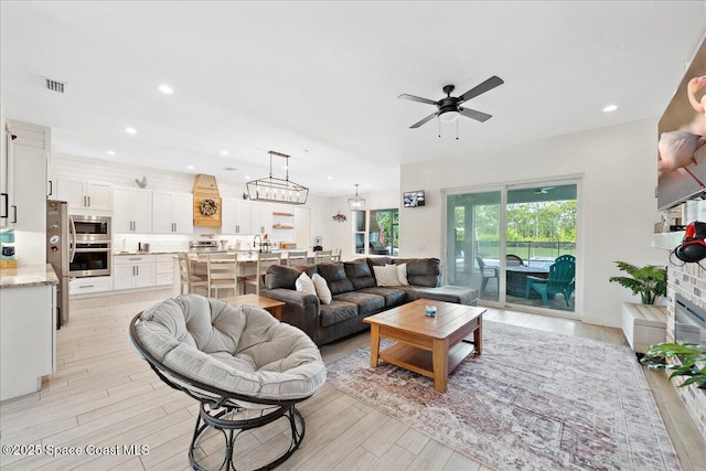 6190 Brabrook Ave, Grant, FL 32949 - living room featuring a ceiling fan, light wood finished floors, and recessed lighting