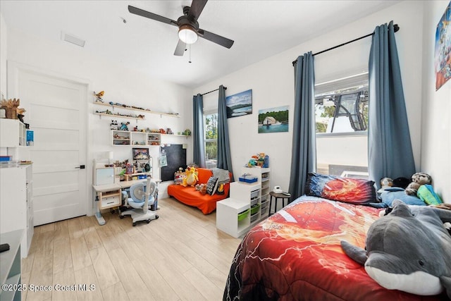 6190 Brabrook Ave, Grant, FL 32949 - bedroom with light wood-style floors and ceiling fan