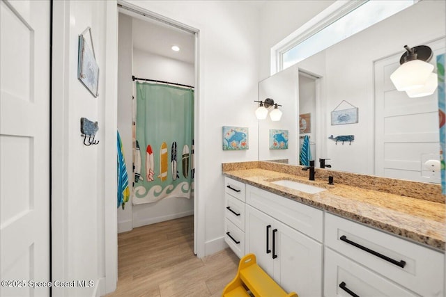 6190 Brabrook Ave, Grant, FL 32949 - bathroom with vanity, wood finished floors, and recessed lighting