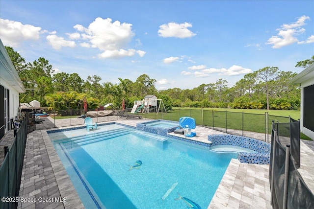 6190 Brabrook Ave, Grant, FL 32949 - view of swimming pool with a playground, a fenced backyard, a pool with connected hot tub, and a patio