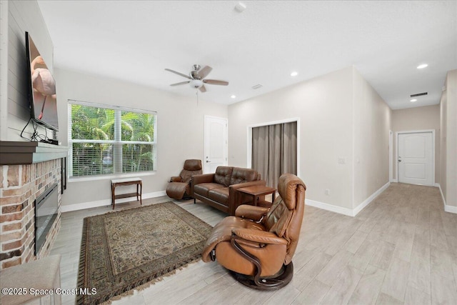 6190 Brabrook Ave, Grant, FL 32949 - living area with a ceiling fan, light wood-type flooring, a fireplace, and recessed lighting