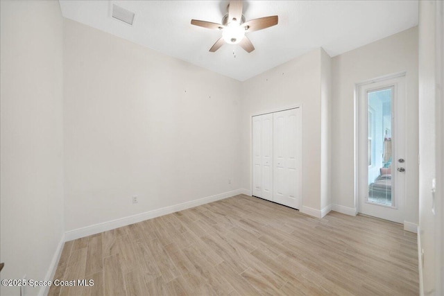 6190 Brabrook Ave, Grant, FL 32949 - unfurnished bedroom featuring light wood-style flooring, a closet, and ceiling fan