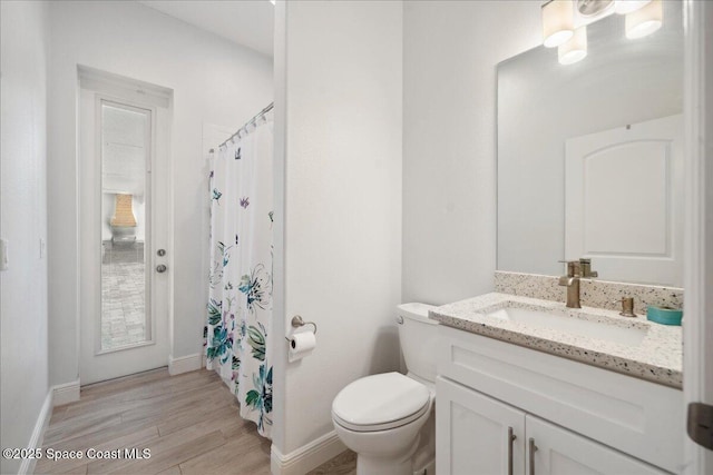 6190 Brabrook Ave, Grant, FL 32949 - full bath with vanity, wood finished floors, and curtained shower