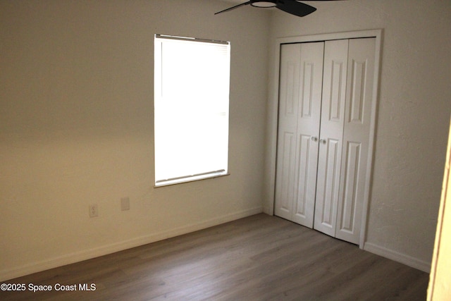 1001 Bernice Rd, Rockledge, FL 32955 - unfurnished bedroom with wood finished floors, a closet, and ceiling fan