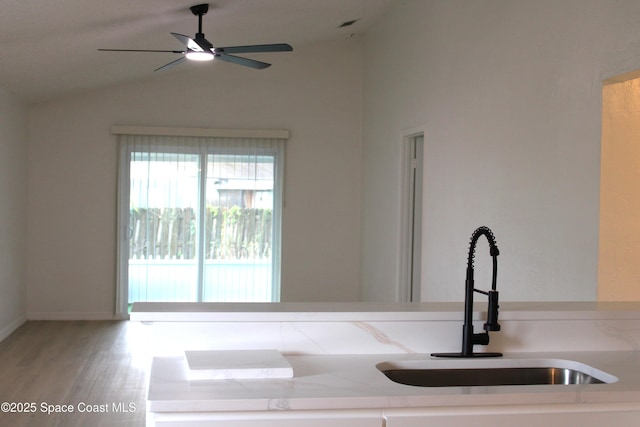 1001 Bernice Rd, Rockledge, FL 32955 - interior space featuring lofted ceiling, ceiling fan, and wood finished floors