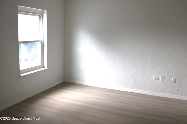 1001 Bernice Rd, Rockledge, FL 32955 - spare room with wood finished floors and baseboards