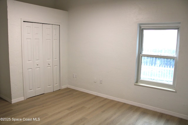 1001 Bernice Rd, Rockledge, FL 32955 - unfurnished bedroom with light wood-type flooring and a closet