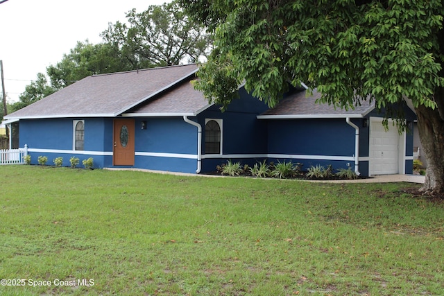 1001 Bernice Rd, Rockledge, FL 32955 - view of front of home featuring stucco siding, a garage, and roof with shingles