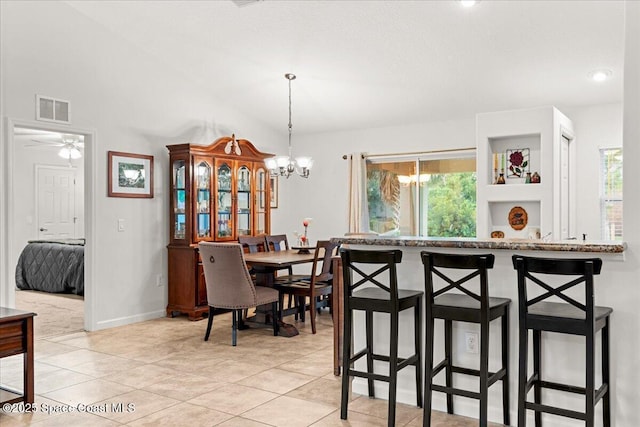5575 Hemsing St, Cocoa, FL 32927 - dining room with a chandelier, plenty of natural light, light tile patterned floors, and ceiling fan