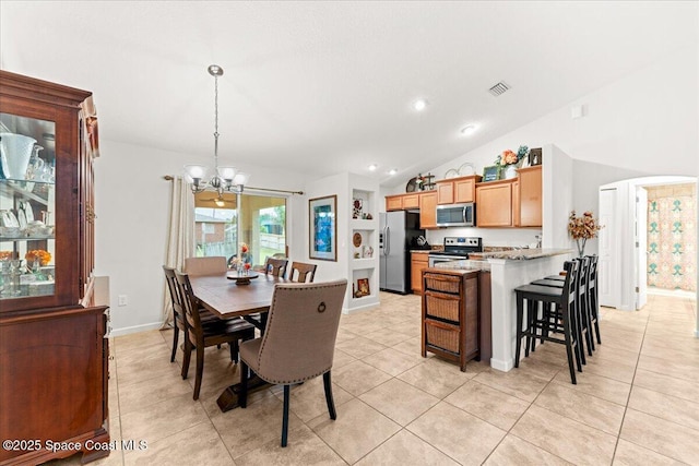 5575 Hemsing St, Cocoa, FL 32927 - dining room featuring a chandelier, light tile patterned flooring, vaulted ceiling, and recessed lighting