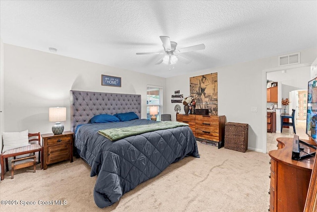 5575 Hemsing St, Cocoa, FL 32927 - bedroom featuring light carpet, a textured ceiling, and a ceiling fan