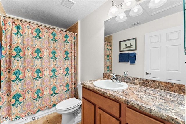 5575 Hemsing St, Cocoa, FL 32927 - bathroom with vanity, a textured ceiling, curtained shower, and tile patterned floors