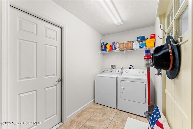 5575 Hemsing St, Cocoa, FL 32927 - washroom featuring washer and clothes dryer, light tile patterned floors, and a textured ceiling