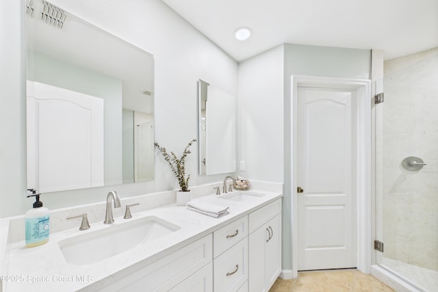 152 Clemente Dr, Satellite Beach, FL 32937 - bathroom featuring double vanity, a stall shower, and tile patterned floors