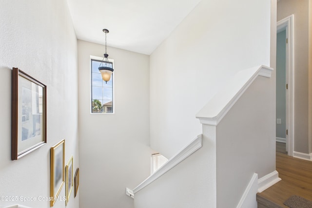 152 Clemente Dr, Satellite Beach, FL 32937 - staircase featuring wood finished floors and baseboards
