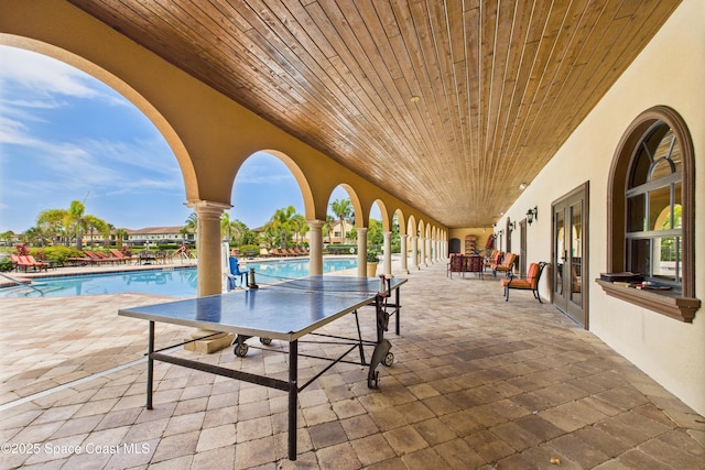 152 Clemente Dr, Satellite Beach, FL 32937 - view of patio / terrace with a community pool and french doors