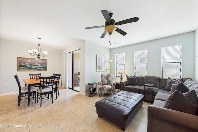 152 Clemente Dr, Satellite Beach, FL 32937 - living room with a chandelier, light tile patterned flooring, and ceiling fan