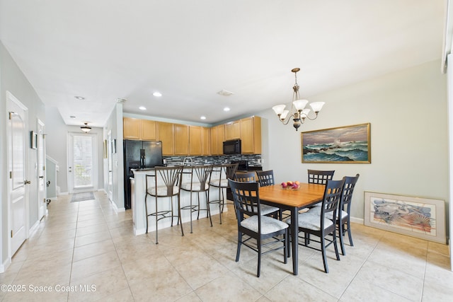 152 Clemente Dr, Satellite Beach, FL 32937 - dining space with a chandelier, light tile patterned floors, and recessed lighting