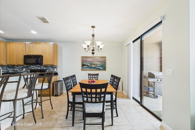 152 Clemente Dr, Satellite Beach, FL 32937 - dining area featuring a chandelier, light tile patterned flooring, and recessed lighting