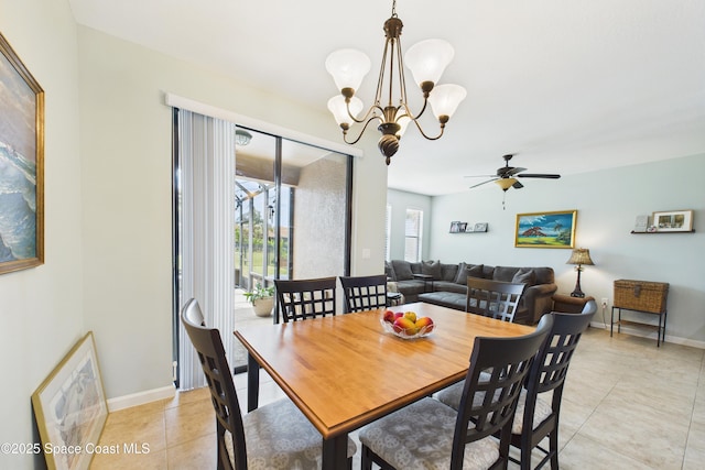 152 Clemente Dr, Satellite Beach, FL 32937 - dining space featuring light tile patterned floors, a ceiling fan, and a chandelier