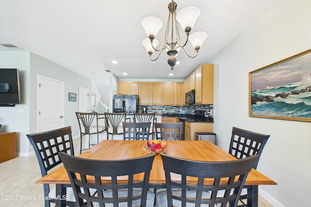 152 Clemente Dr, Satellite Beach, FL 32937 - dining space featuring a chandelier, recessed lighting, and light tile patterned floors