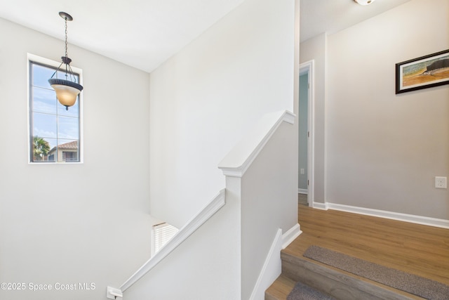 152 Clemente Dr, Satellite Beach, FL 32937 - staircase featuring wood finished floors and baseboards