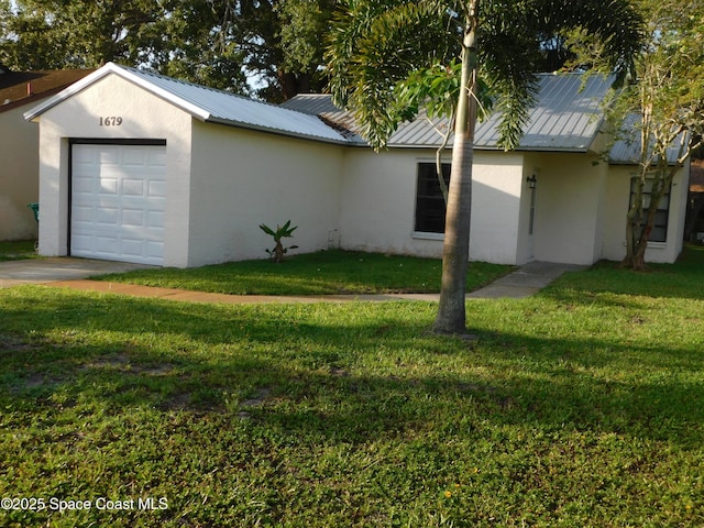 1679 Cardinal Ct, Melbourne, FL 32935 - view of property exterior with stucco siding, a metal roof, a yard, and a standing seam roof