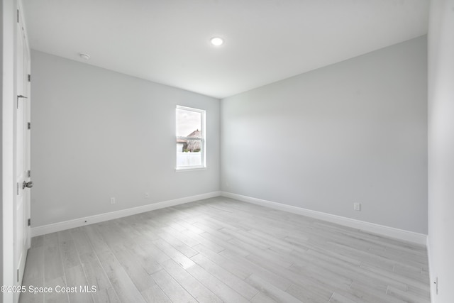 210 La Gore St, Palm Bay, FL 32908 - empty room with light wood-style floors and recessed lighting