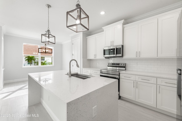 210 La Gore St, Palm Bay, FL 32908 - kitchen featuring stainless steel appliances, crown molding, an island with sink, decorative backsplash, and white cabinetry