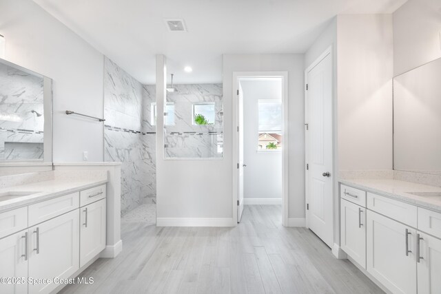 210 La Gore St, Palm Bay, FL 32908 - full bath featuring a marble finish shower, vanity, wood finished floors, and recessed lighting