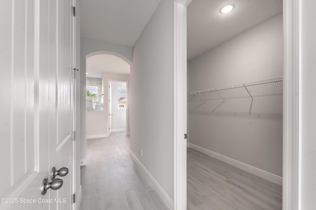 210 La Gore St, Palm Bay, FL 32908 - hallway featuring arched walkways and light wood-type flooring