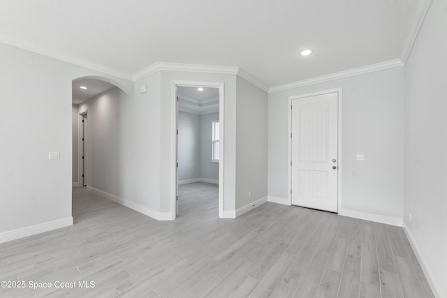 210 La Gore St, Palm Bay, FL 32908 - empty room with arched walkways, light wood-type flooring, ornamental molding, and recessed lighting