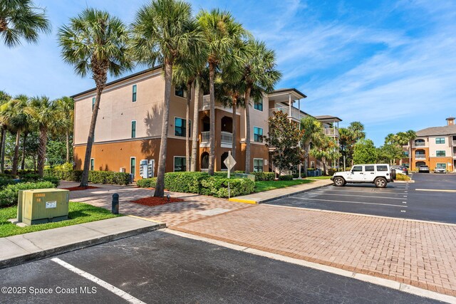 6461 Borasco Dr Unit 3808, Melbourne, FL 32940 - view of property featuring uncovered parking