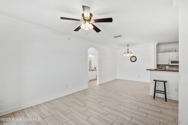 6461 Borasco Dr Unit 3808, Melbourne, FL 32940 - unfurnished living room with ornamental molding, ceiling fan, arched walkways, and light wood finished floors