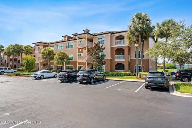 6461 Borasco Dr Unit 3808, Melbourne, FL 32940 - view of apartment building / complex with uncovered parking