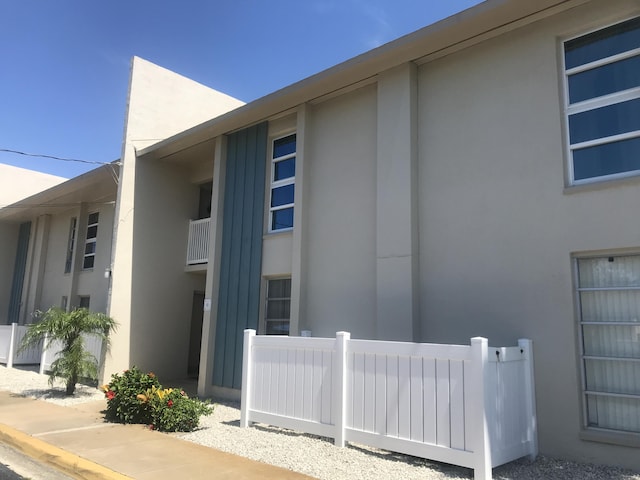250 N Banana River Dr Unit F-11, Merritt Island, FL 32952 - view of side of home featuring stucco siding
