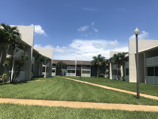 250 N Banana River Dr Unit F-11, Merritt Island, FL 32952 - view of community with a lawn