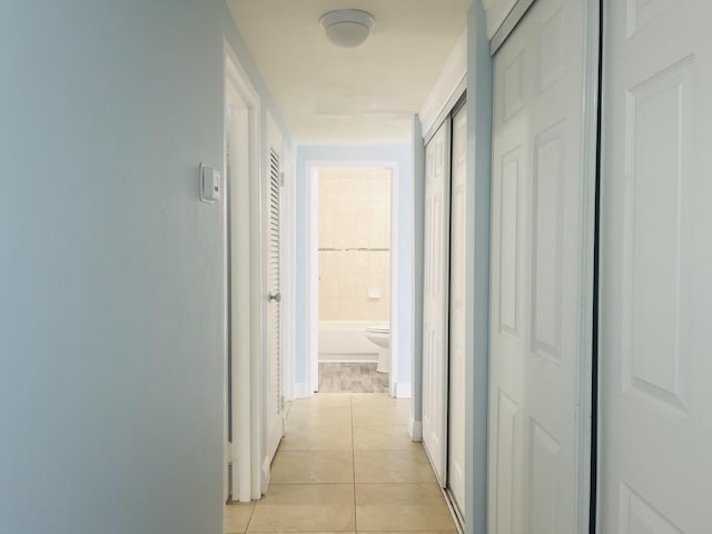 250 N Banana River Dr Unit F-11, Merritt Island, FL 32952 - hall with light tile patterned floors and baseboards